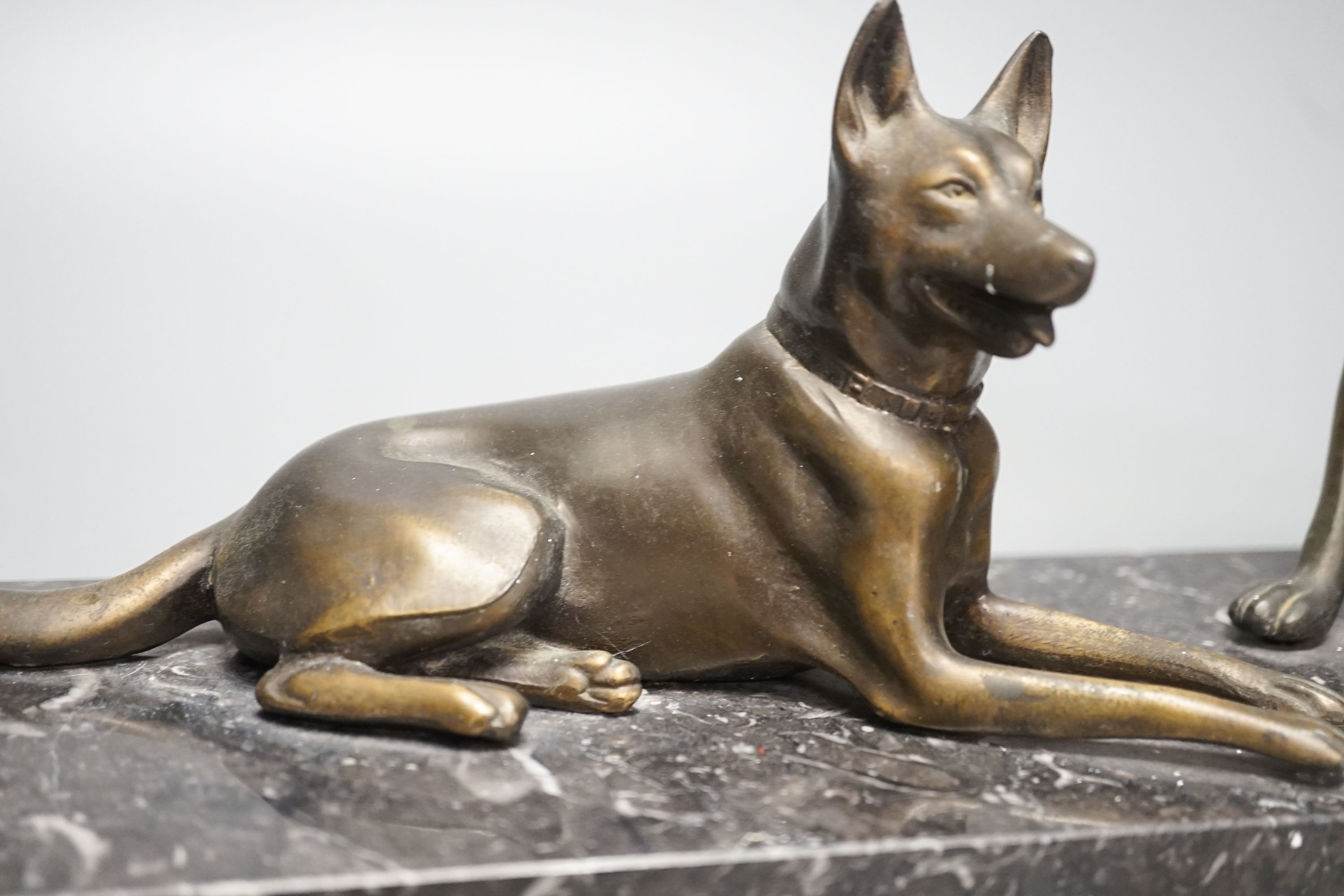 An Art Deco patinated spelter German Shepherd group, 40cm